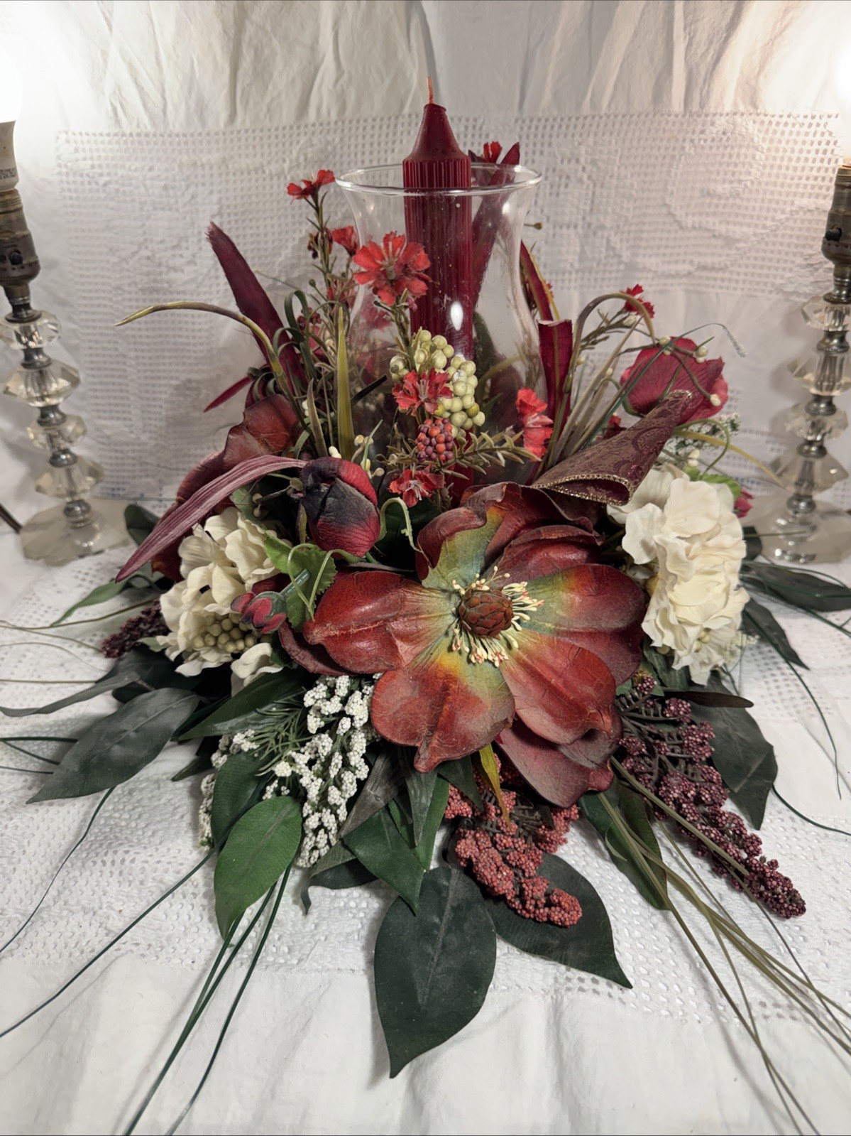 Artificial Fall Themed Floral Centerpiece Surrounding A Glass Vase