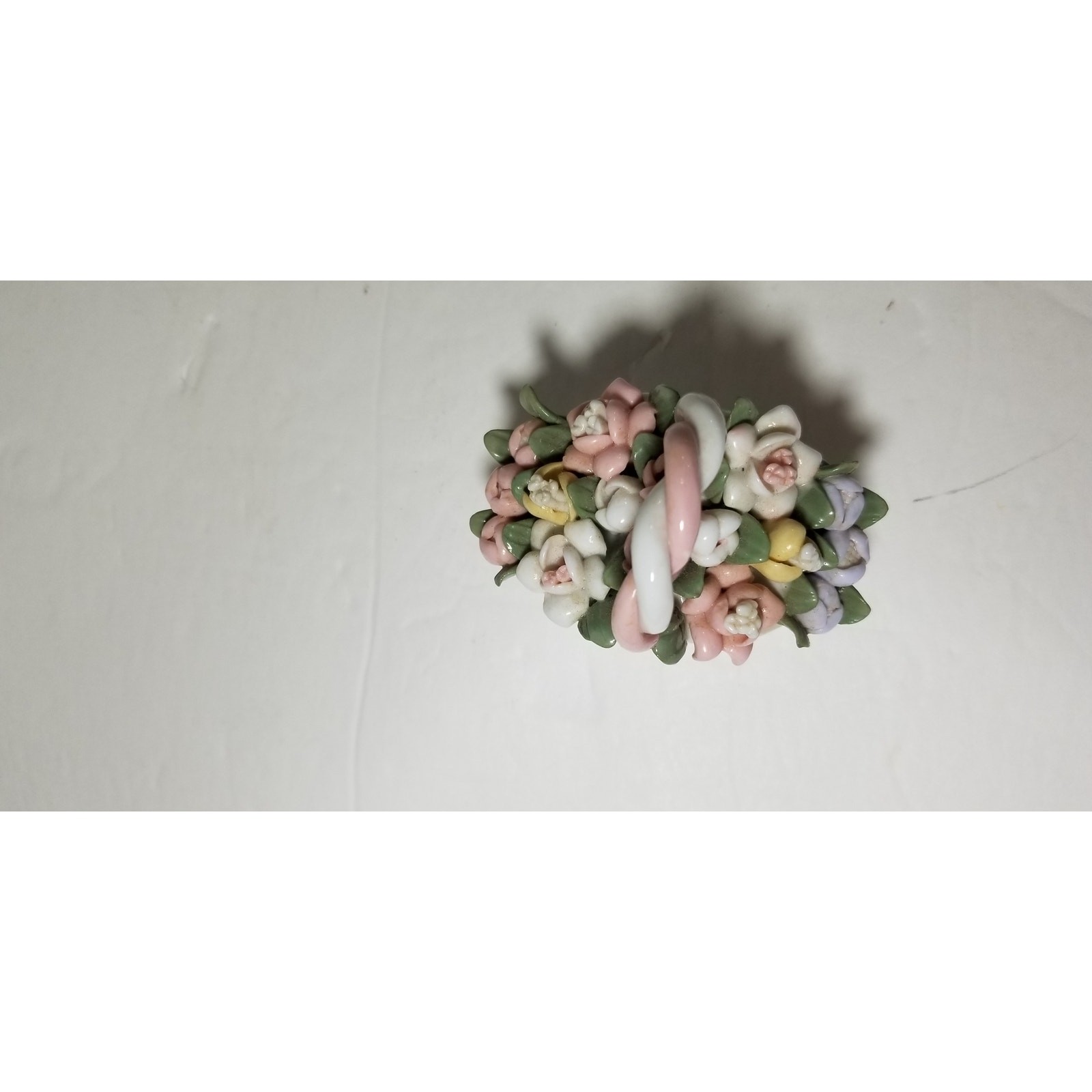 Three inch by 3 inch hand painted porcelain basket (1.1282)