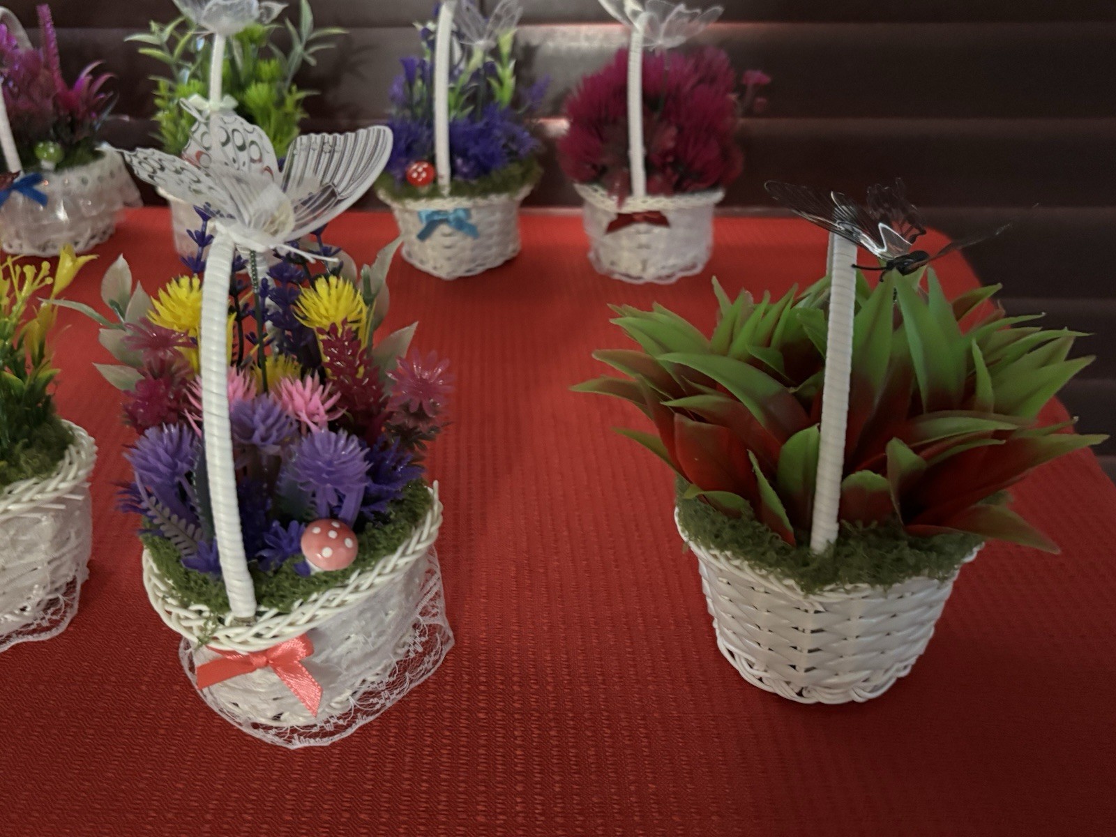 Artificial Floral Arrangement in White Wicker Baskets, Butterfly Accent