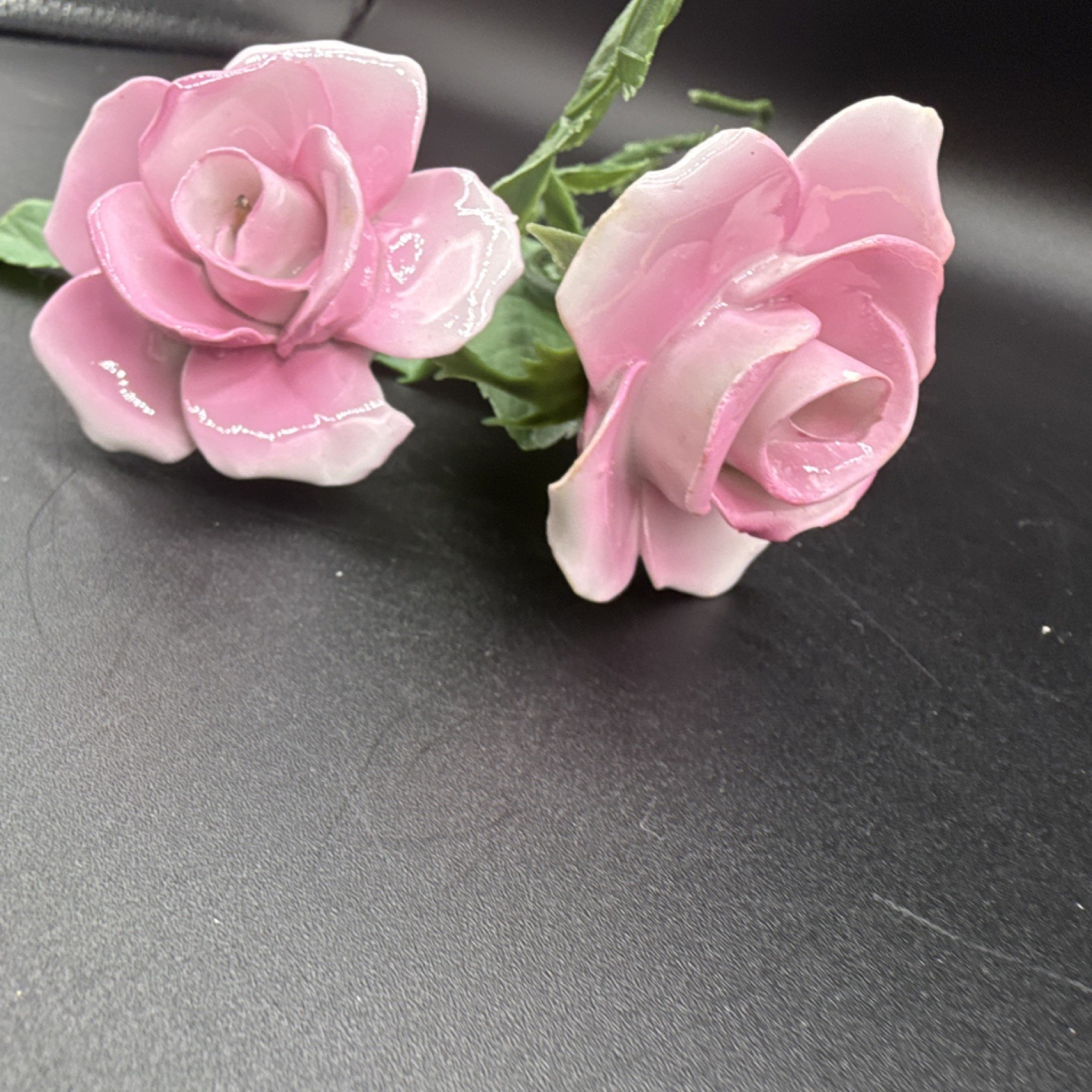 Porcelain flowers, pink roses with plastic stems and leaves