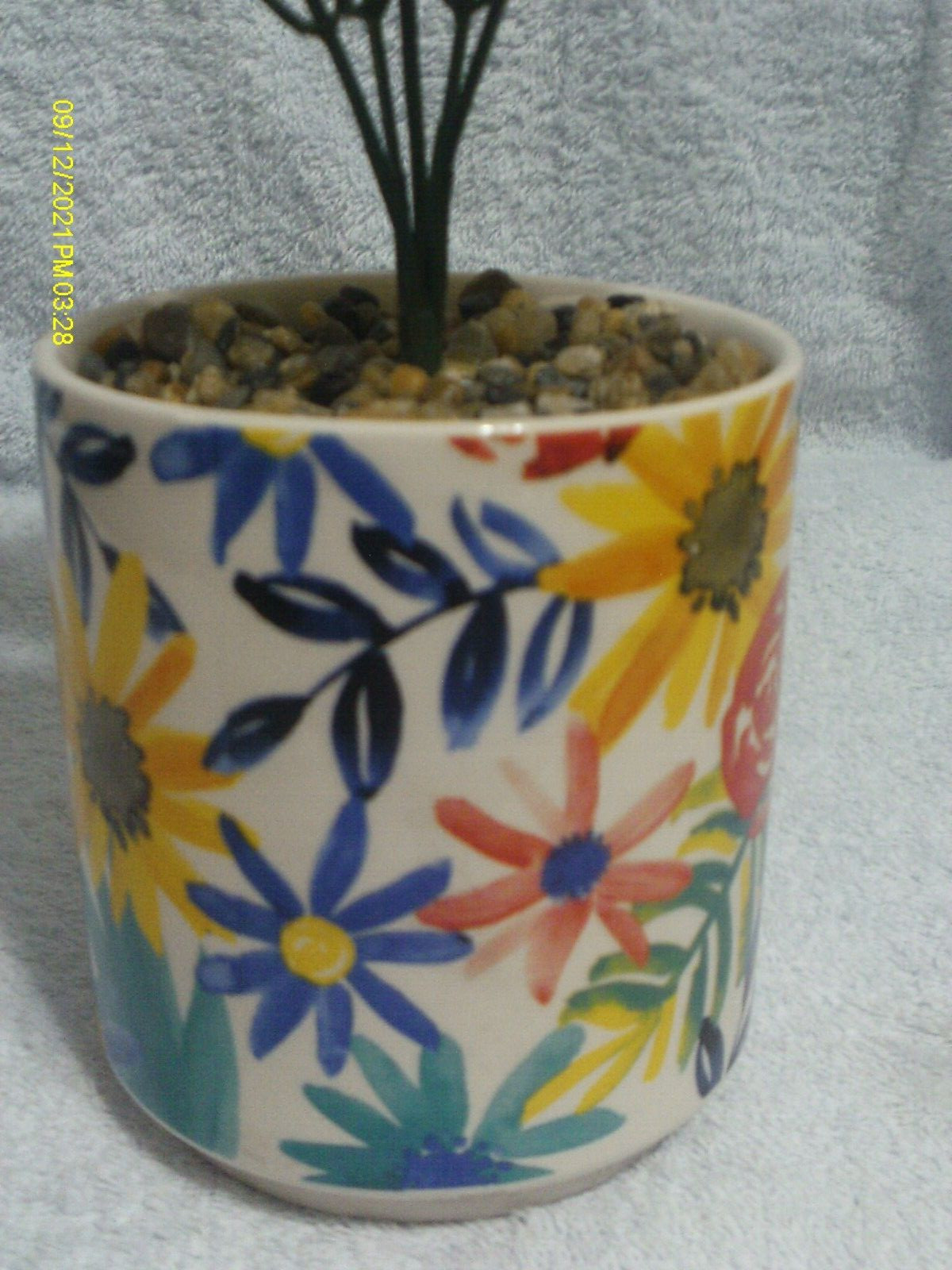 Faux Plant In Ceramic Floral Pot With Stones