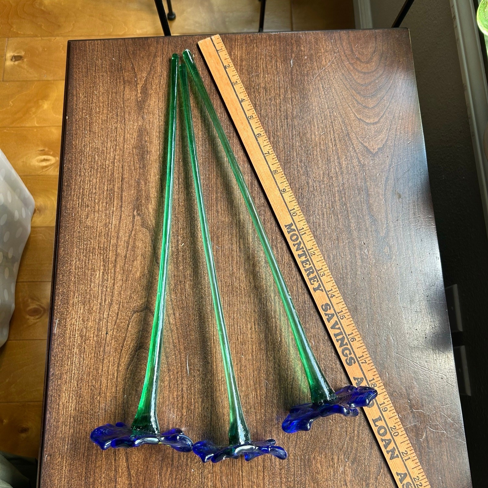 Handcrafted blue and yellow glass flower sculptures long green stems