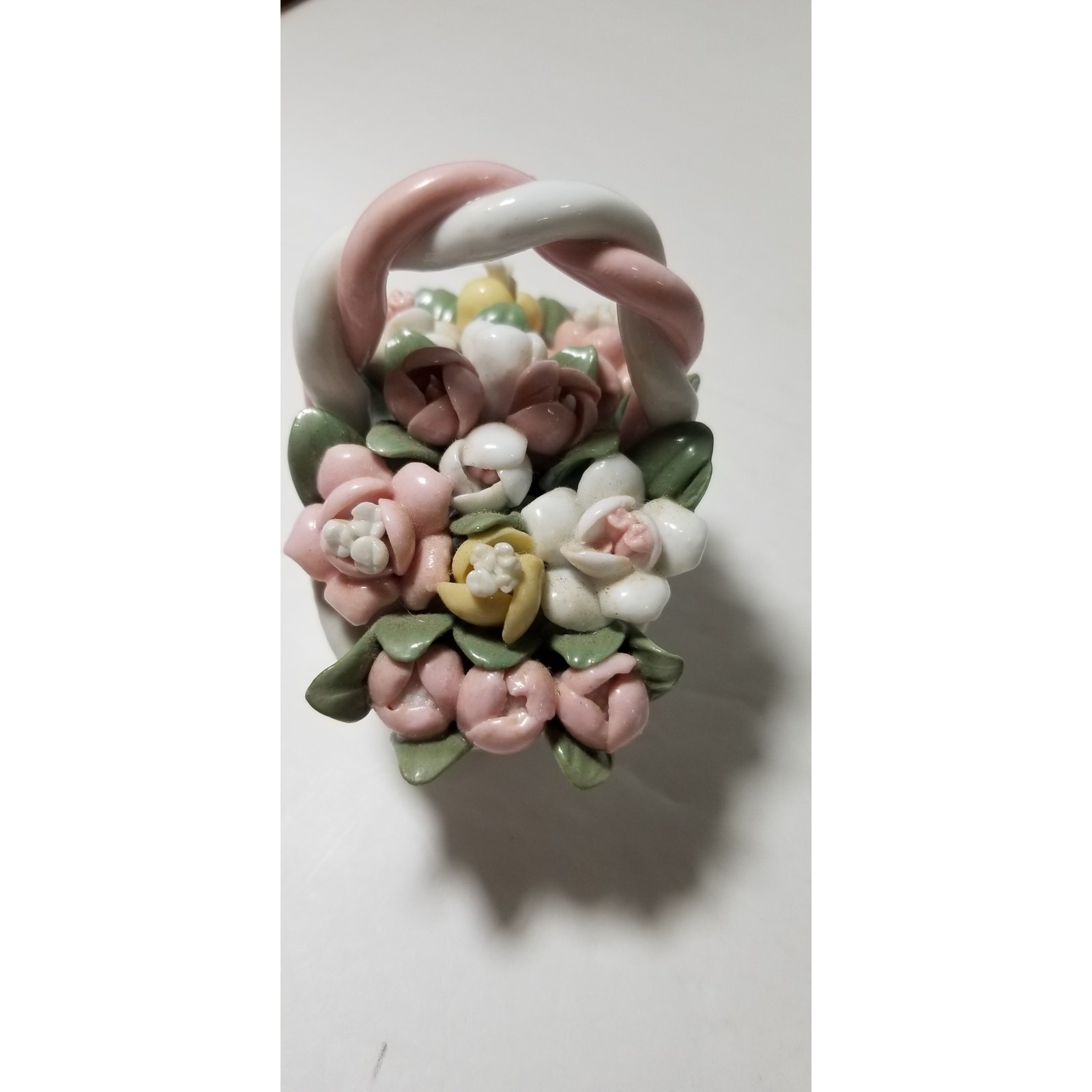 Three inch by 3 inch hand painted porcelain basket (1.1282)