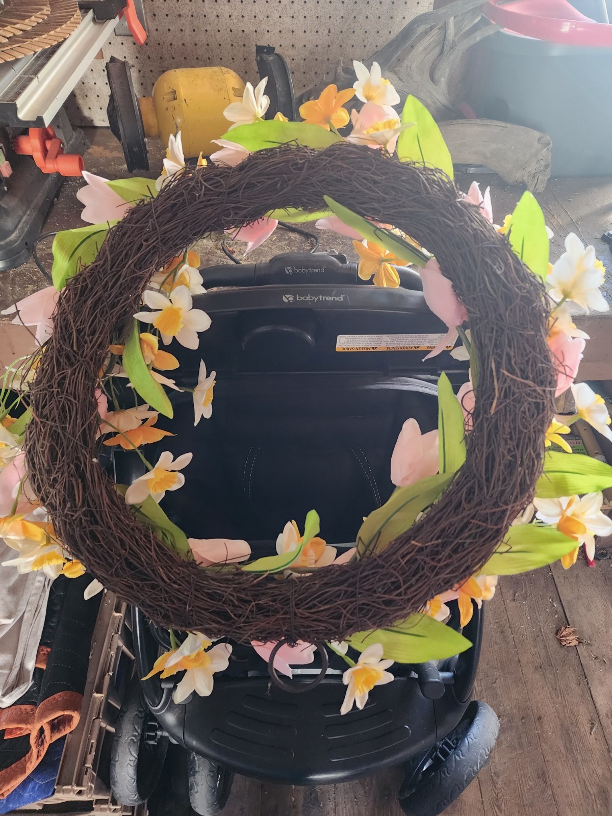 Artifical flower wreath with pink, yellow and white flowers