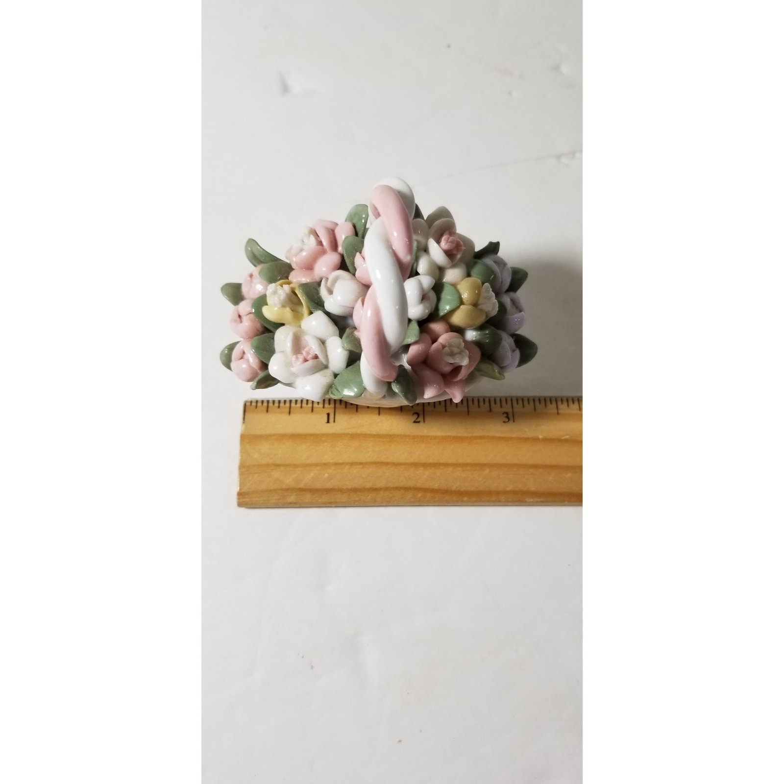 Three inch by 3 inch hand painted porcelain basket (1.1282)