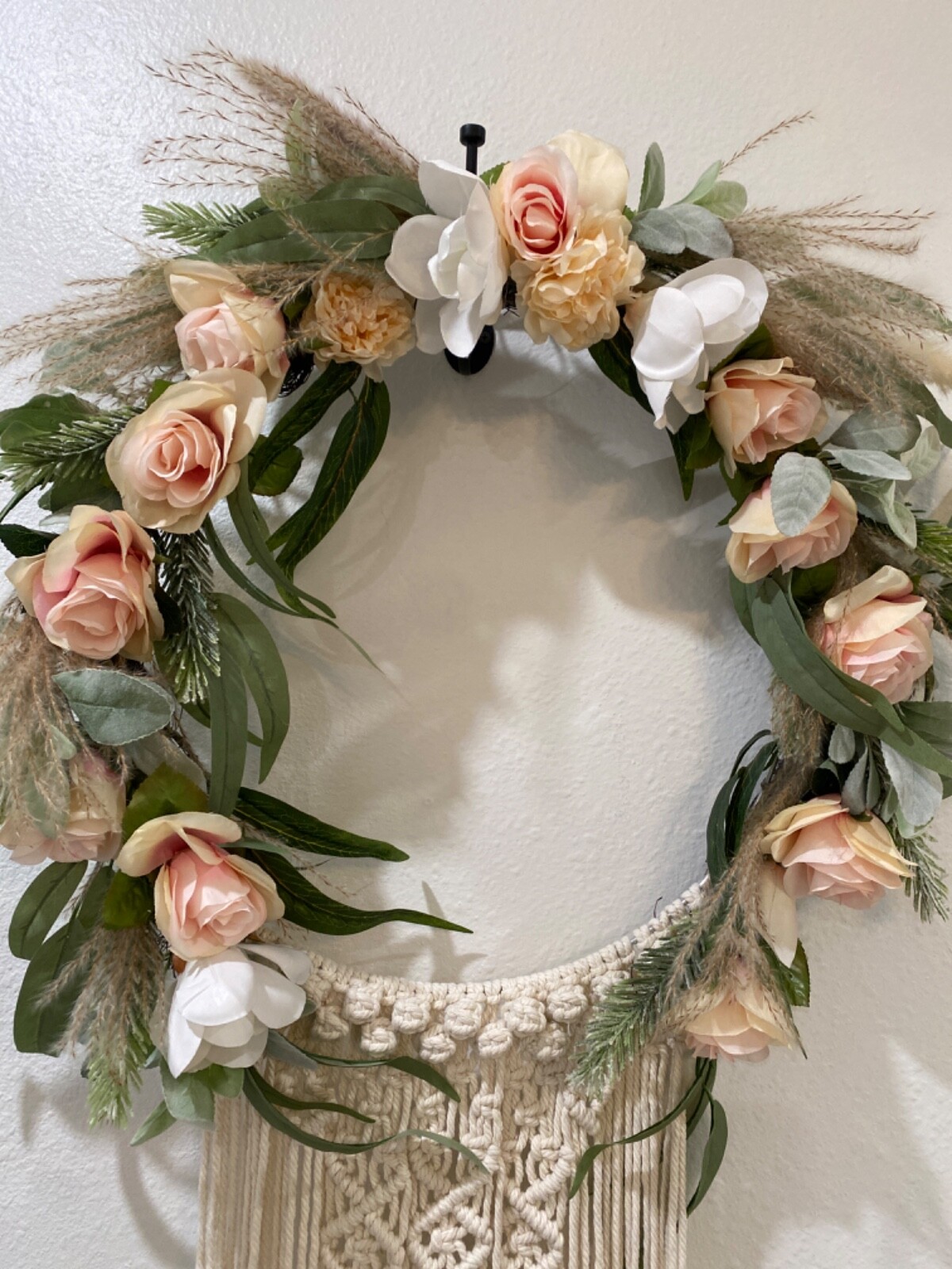 Macramé Boho pastel colored flowered wreath. Measures 58 inches in length
