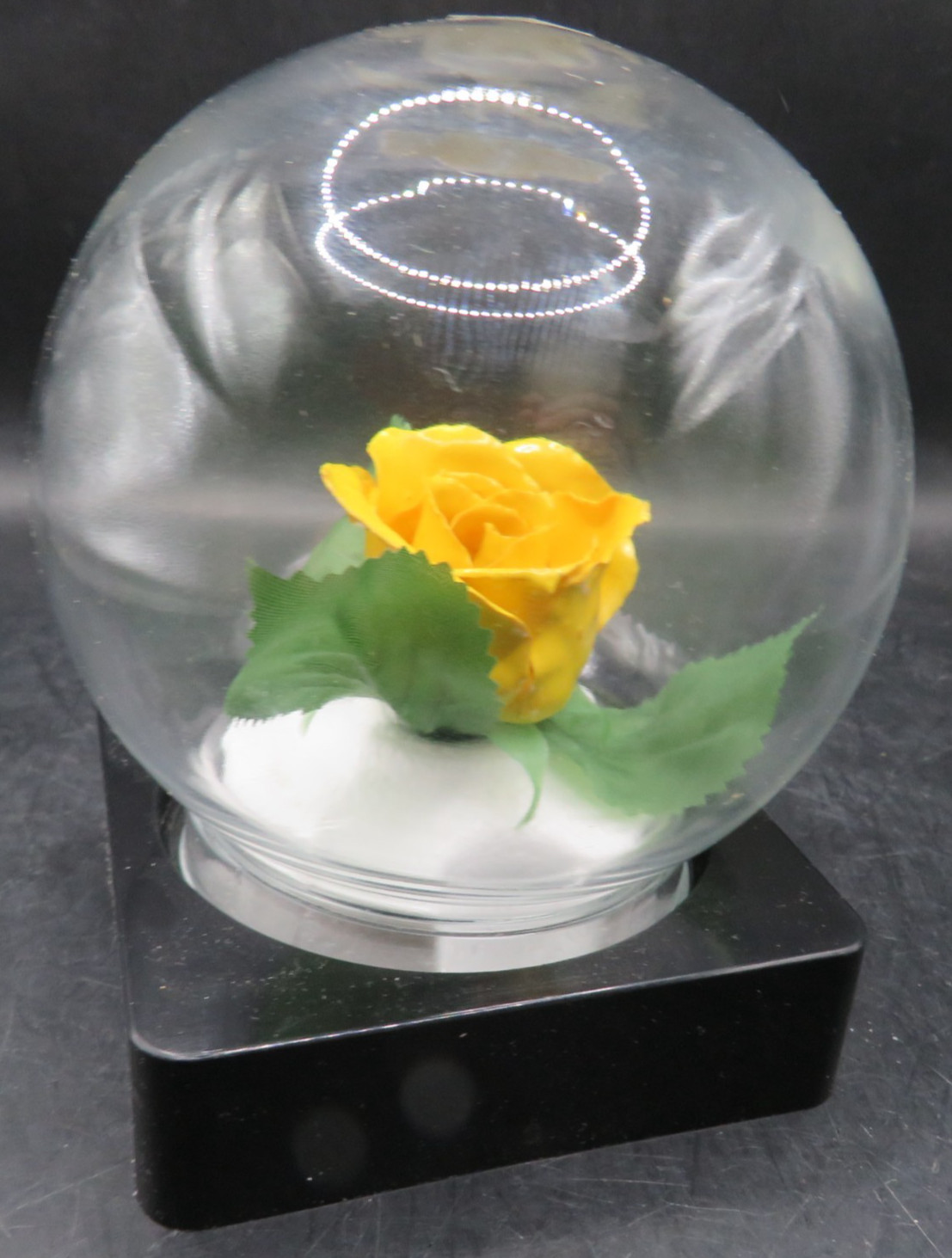 Lifesake Flowers REAL ROSES Yellow Rose In a clear globe on a back base.