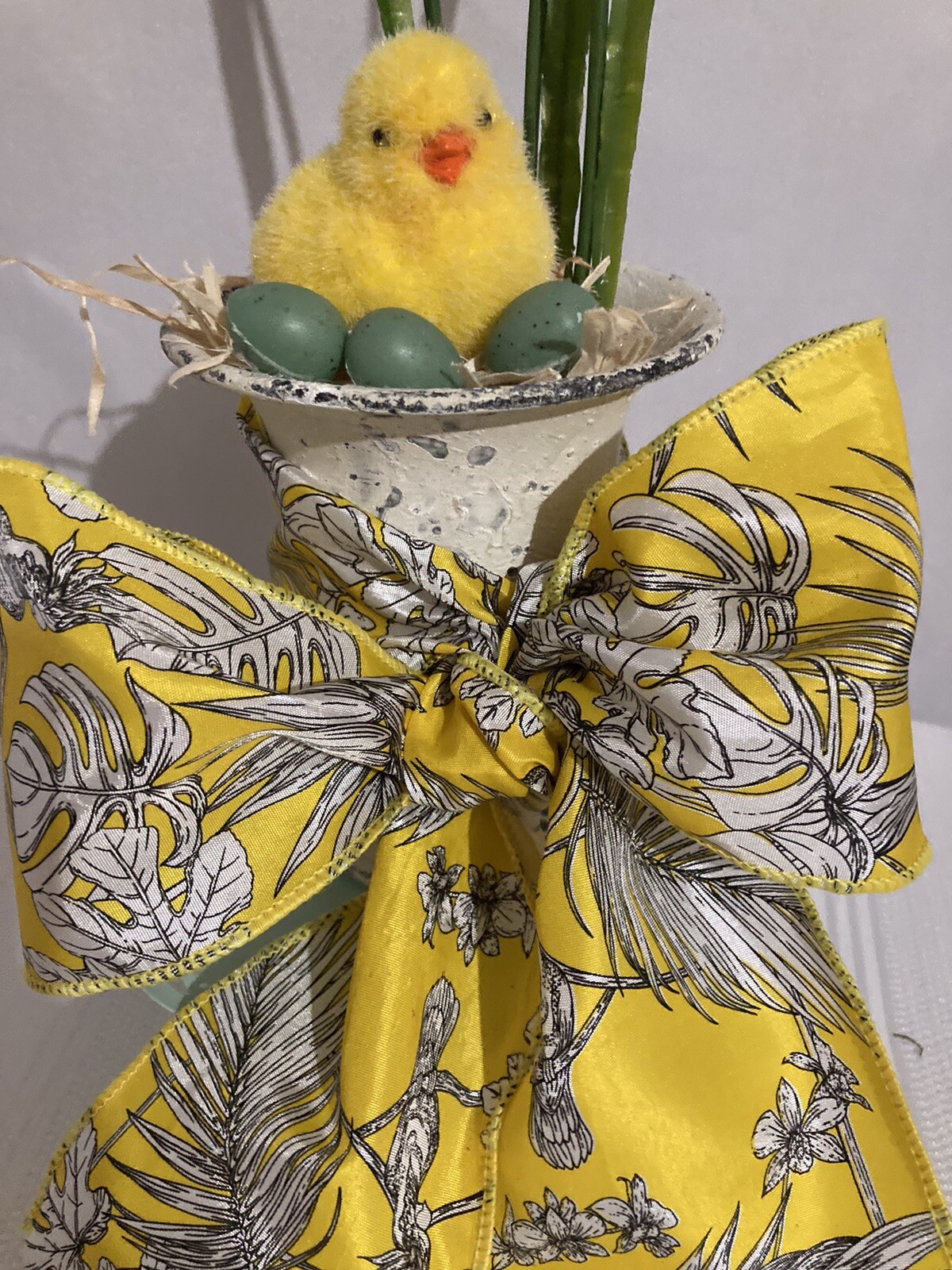 Cute Little Yellow Chick With Eggs In An Urn