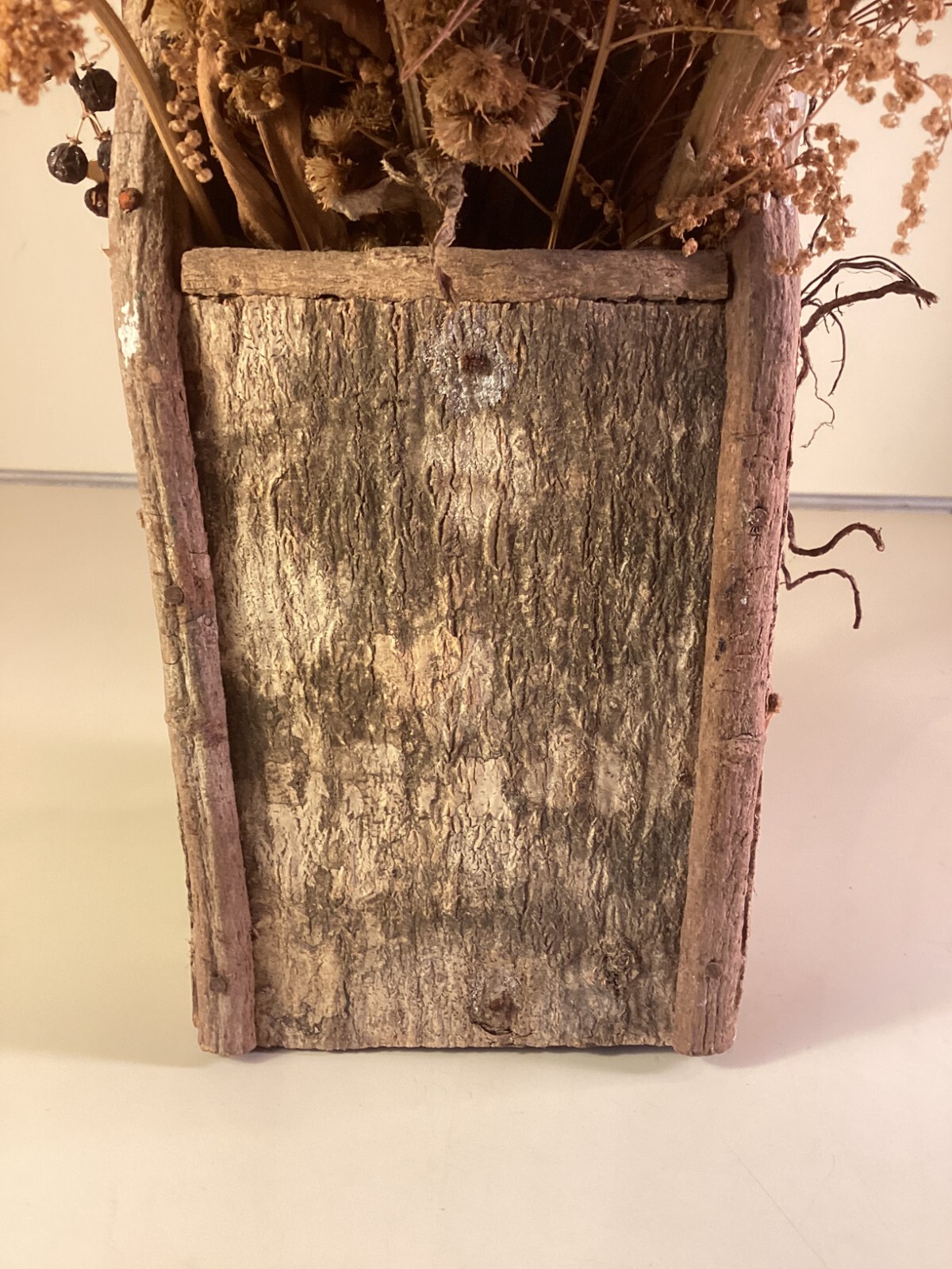 Wood birdhouse centerpiece with dried flowers, turkeys, twigs, windows, chimney