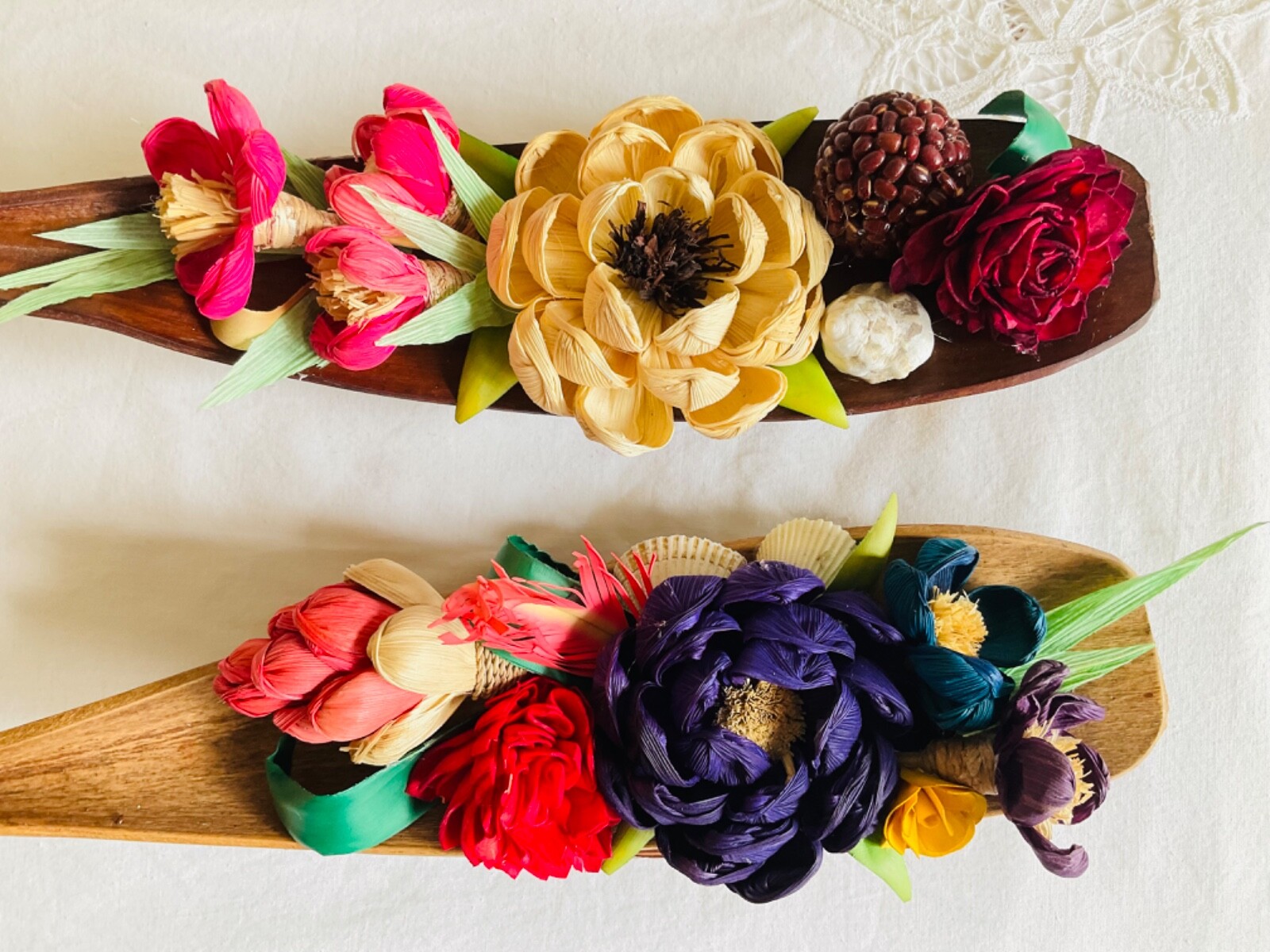 flower arrangements. Coconut spathe vase, dried corn husks, naturals.