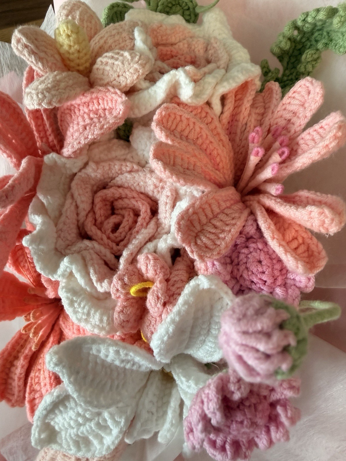 A beautiful handmade crochet flower bouquet, carefully crafted in soft pink, whi