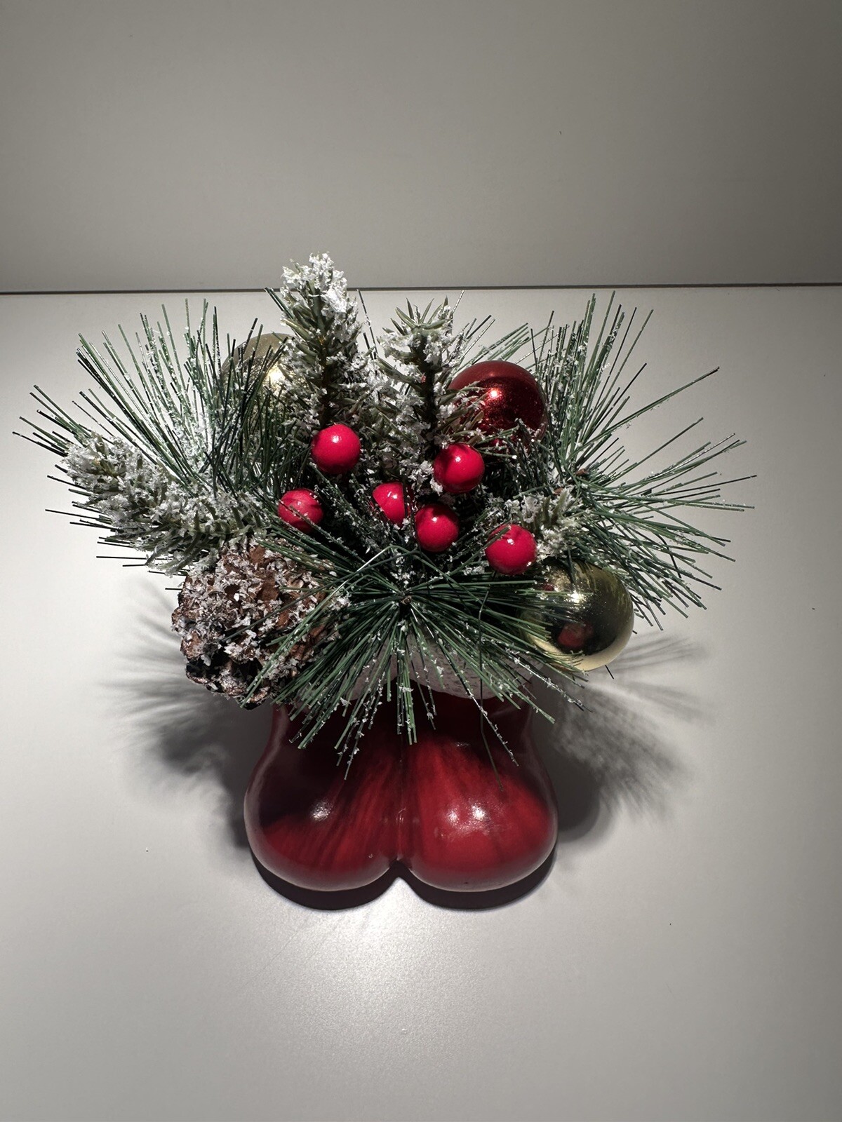 Vintage Concrete Pine Christmas Arrangement in A Pair Of Red Santa Clause Boots
