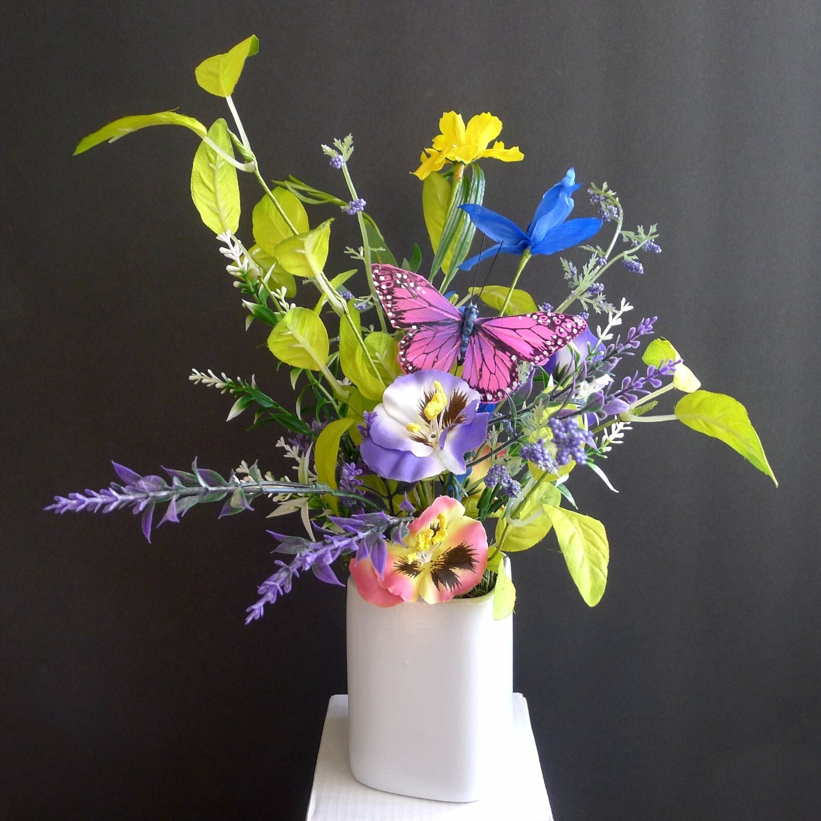 Wildflower Pansy Floral Arrangement Pink Feather Butterfly and a White Planter