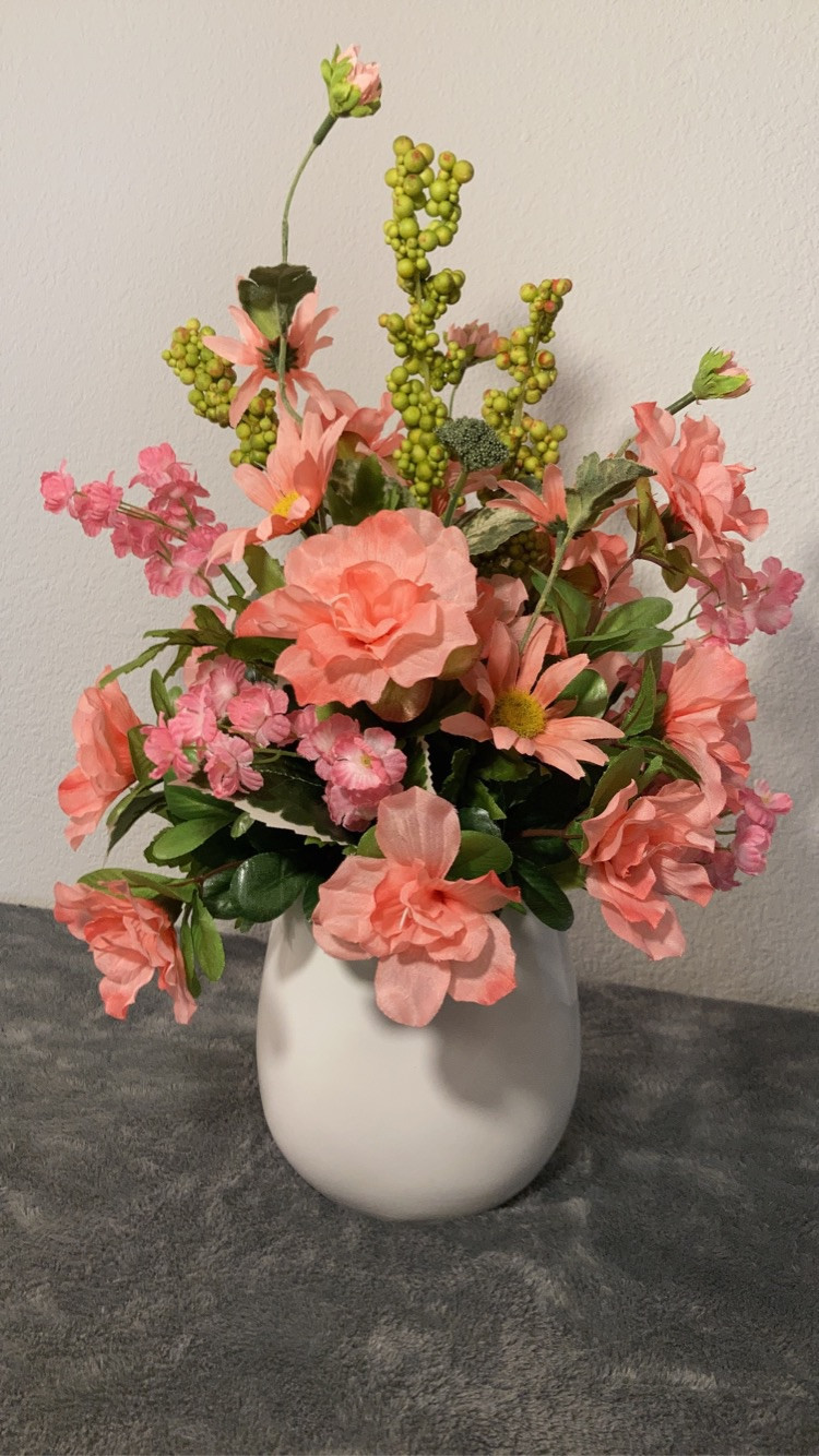 Artificial floral arrangement in ceramic owl vase