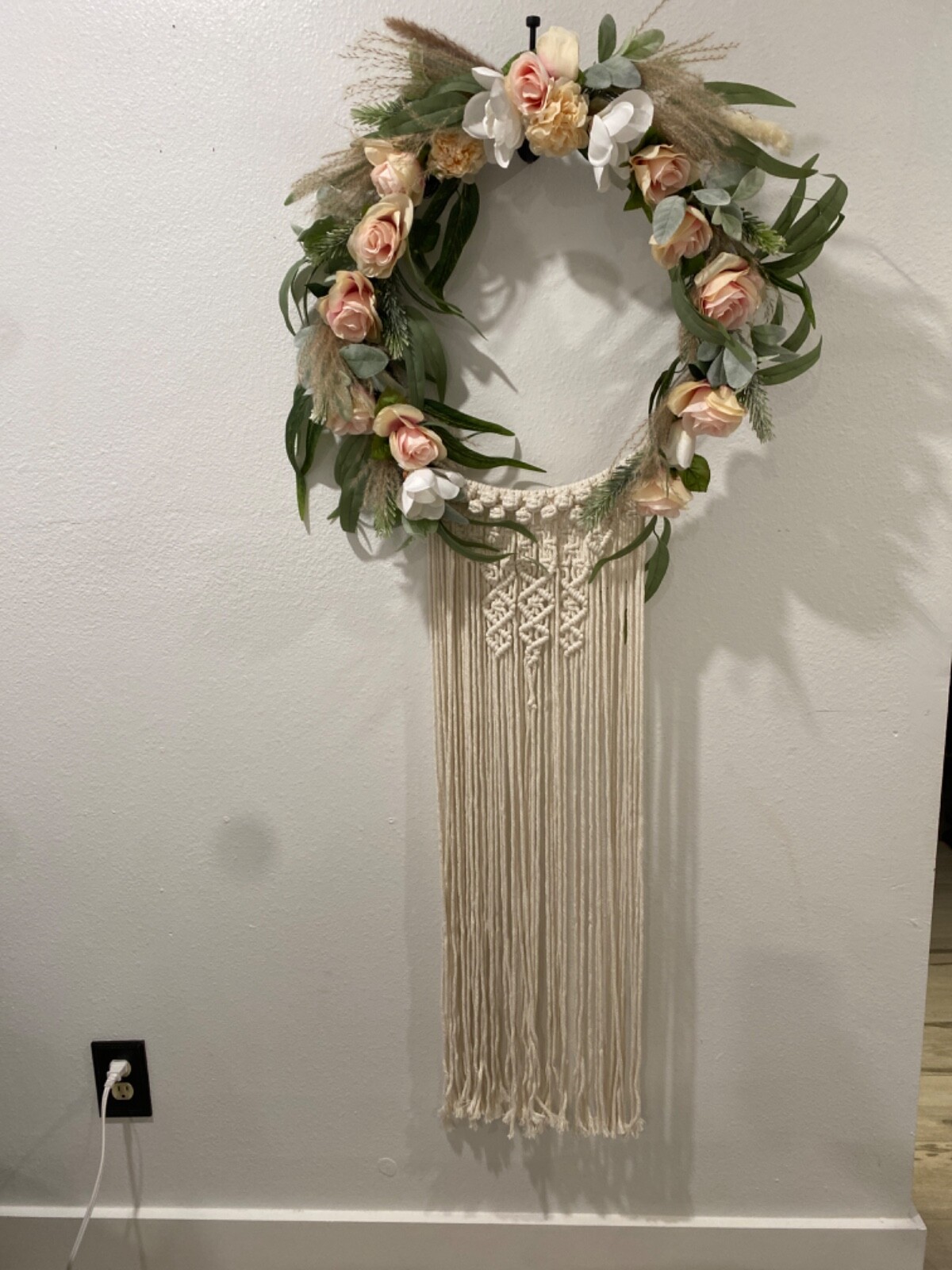 Macramé Boho pastel colored flowered wreath. Measures 58 inches in length