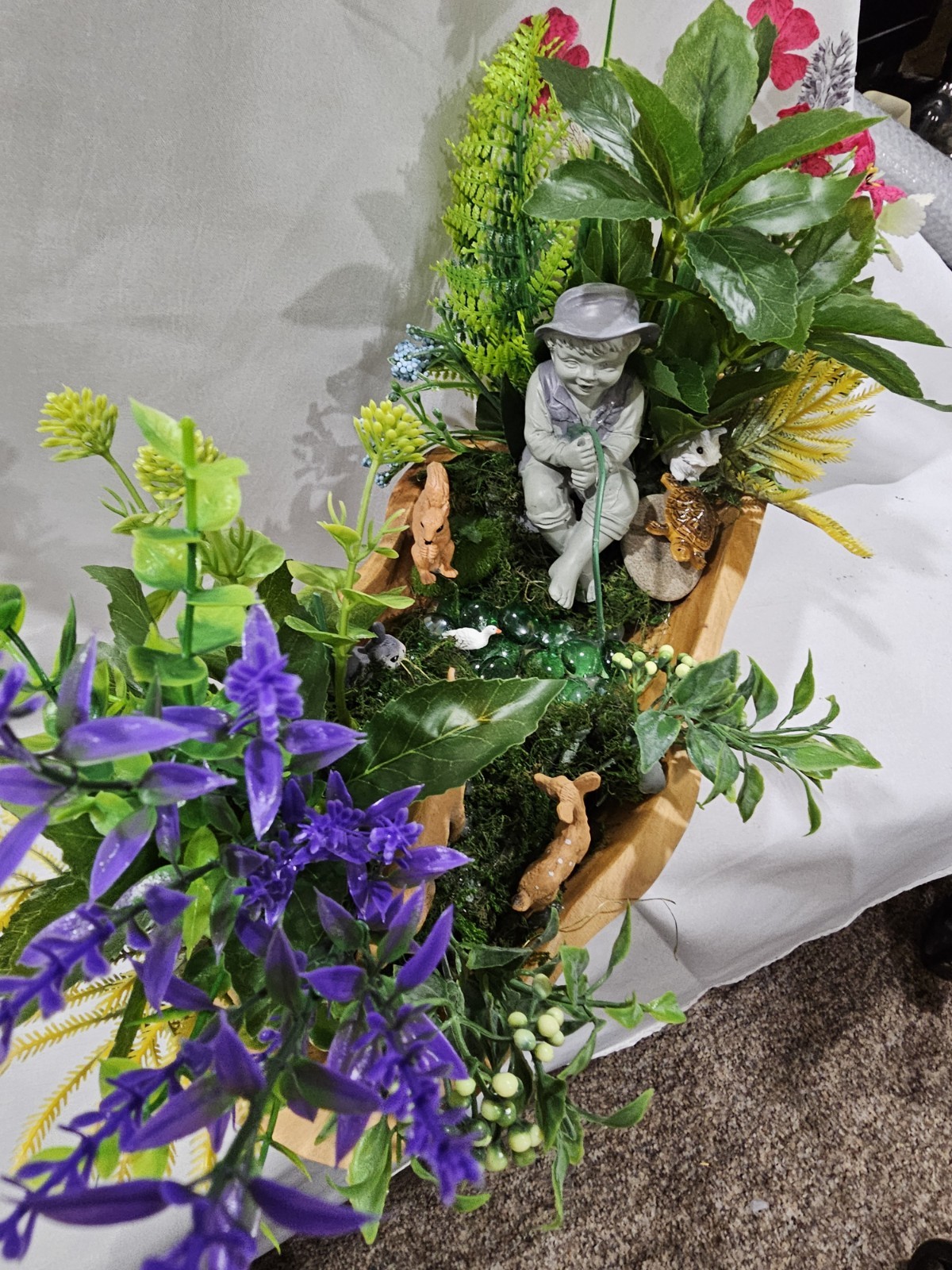 Artifical Flower Arramgement in woods, Boy Fishing Deer, Turtle Duck