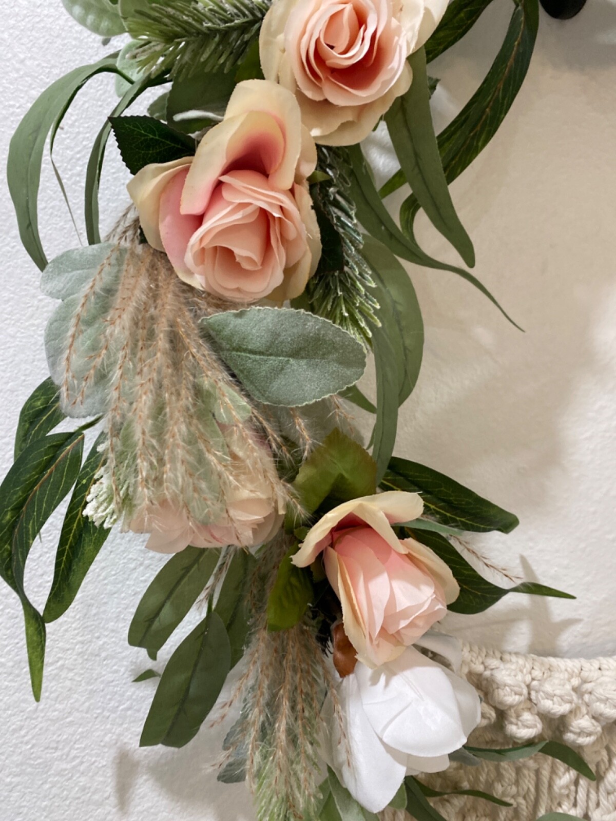 Macramé Boho pastel colored flowered wreath. Measures 58 inches in length